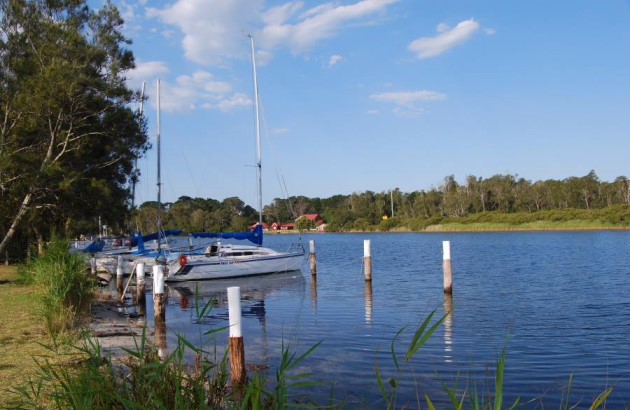 The Sussex Inlet connects St Georges Basin and the Ocean. Just opposite is Booderee National Park.