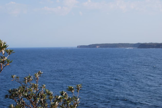 Warden Head with the lighthouse in the center of the photo, Ulladulla